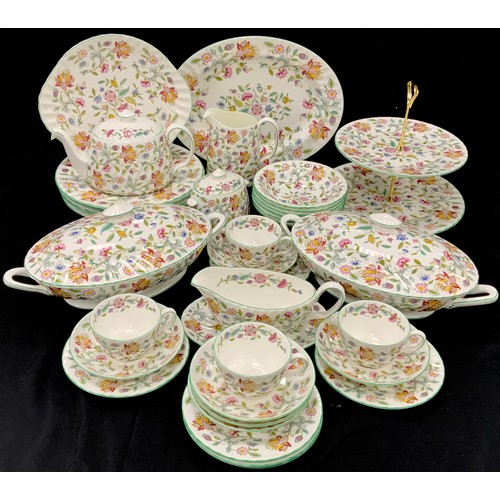 166 - A Minton Haddon Hall pattern dinner set inc two oval tureens and covers, meat plate, two tier cake s... 