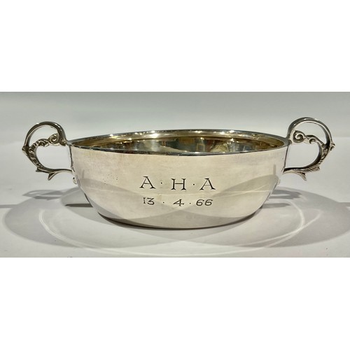 63 - A sterling silver two-handled bowl, scroll handles, Sheffield, 1964, 100g