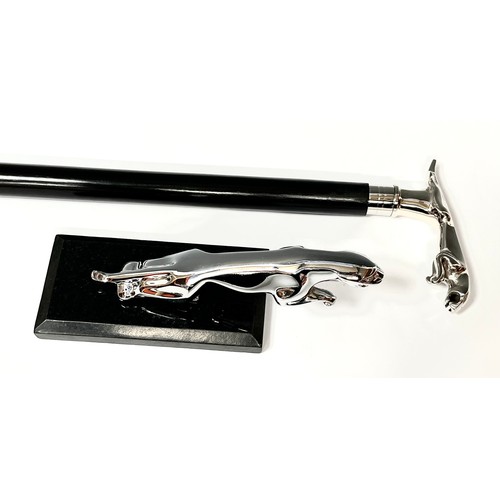 360 - A silver coloured car mascot, as a Jaguar, mounted on black marble plinth, 21cm long overall; An ebo... 