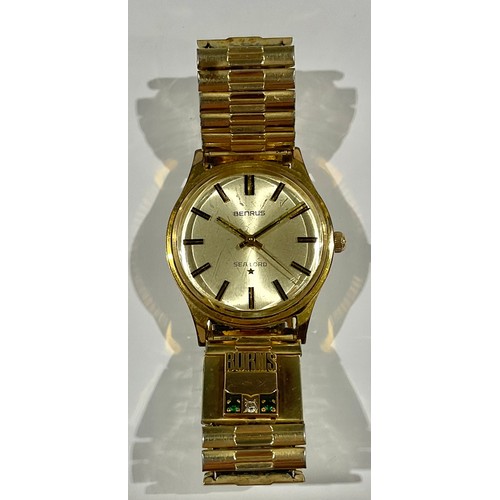 605 - A gentleman's Benrus Sea Lord 14k gold plated watch, Champagne dial, baton indicators, centre second... 