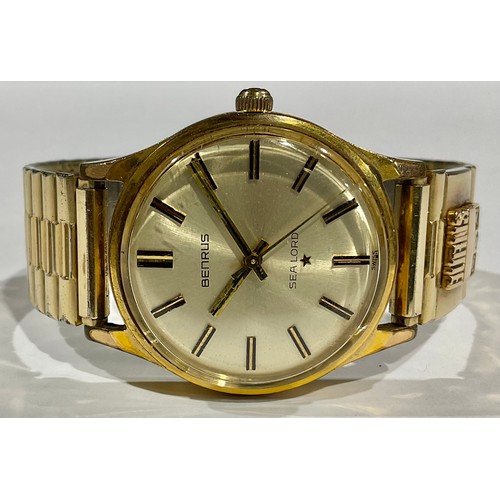 605 - A gentleman's Benrus Sea Lord 14k gold plated watch, Champagne dial, baton indicators, centre second... 