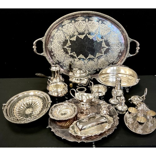 84 - A large oval silver plated tray,  salver,  three piece tea set, swing handle basket,  condiments set... 