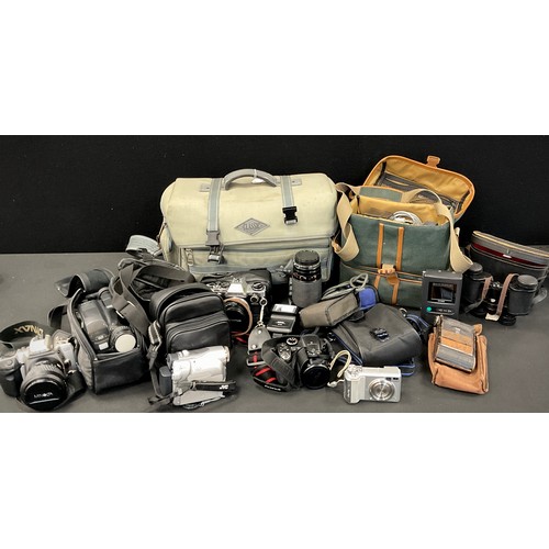 92 - Cameras and camera equipment - an Olympus OM10 35mm camera, with OM-System 50mm f/1.8 lens, Olympus ... 