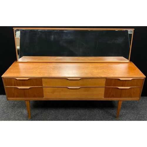 121 - A Danish style teak dressing table, by Austinsuite, London. 117cm high (69cm high to top of table) x... 