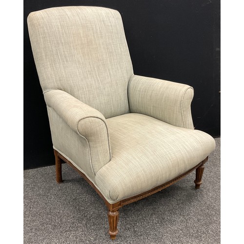 152 - A French Style upholstered walnut low armchair, 94cm high (37cm seat height) x 74cm wide.