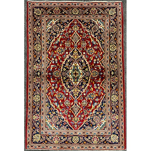 162 - A Central Persian Kashan rug / carpet, hand-knotted with navette-shaped medallion, within a field of... 