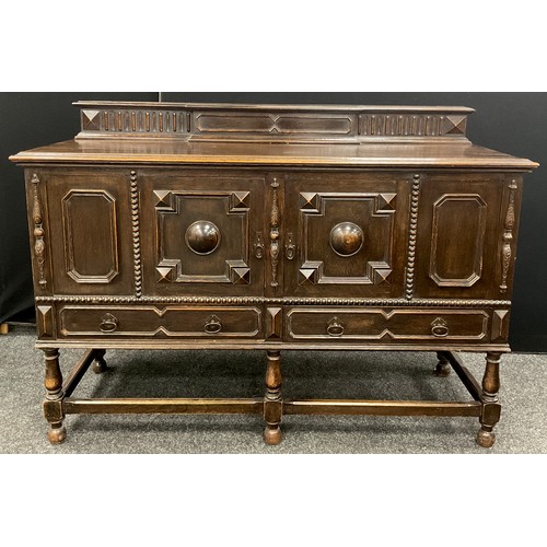 177 - An early 20th century Jacobean Revival oak sideboard, by Greenlands of Hereford, 108cm high x 152cm ... 