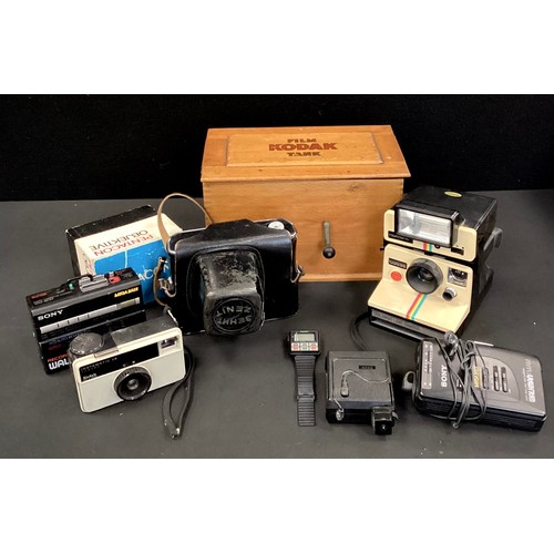 57 - Cameras and Equipment - A Kodak film Tank, Polaroid 1000SE, Kenit Em 2/58 camera, cased, 1980's walk... 