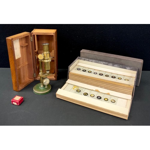 222 - An early 20th century brass travelling microscope, with mahogany case, and a large collection of pre... 