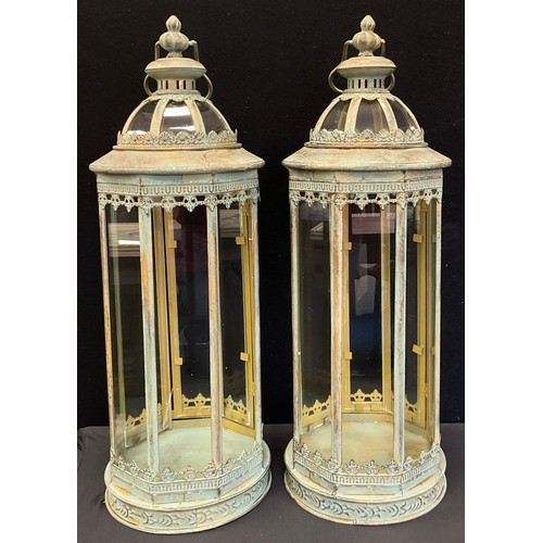 147A - A pair of reproduction 19th century style domed top, floor standing lanterns, 60cm high (2)