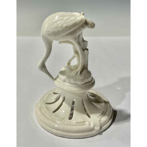 76 - A Nymphenburg model of a crane, glazed throughout in gloss white, 11cm, impressed mark