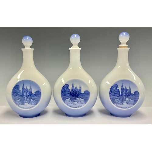 79 - A set of three Royal Copenhagen compressed ovoid bottle vases and covers, printed with Rosenborg Cas... 