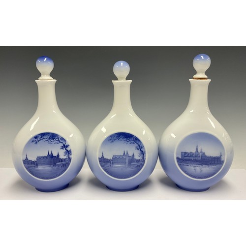 82 - A set of three Royal Copenhagen compressed ovoid bottle vases and covers, two printed with Frederiks... 