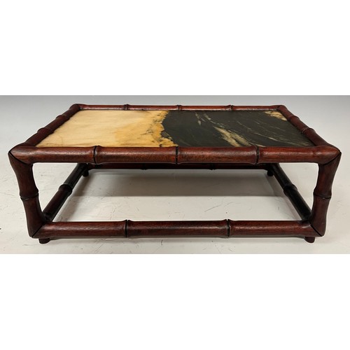 93 - A Chinese faux bamboo framed stand, the top inset with a rectangular simulated hardstone in mottled ... 