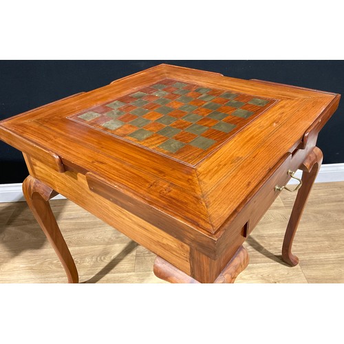 107 - A contemporary games table, removable square top inlaid for chess, the verso with baize, enclosing a... 