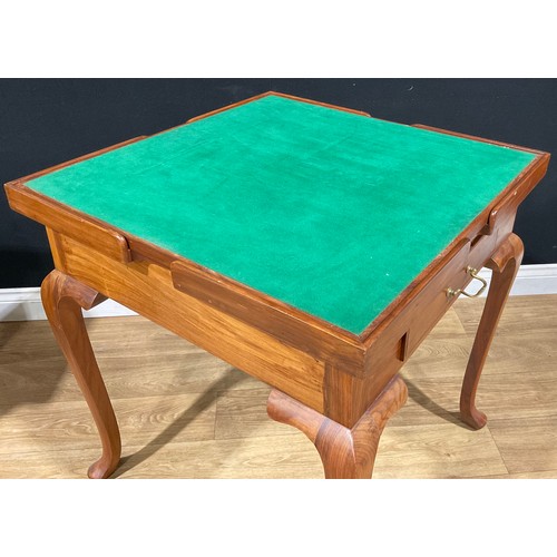 107 - A contemporary games table, removable square top inlaid for chess, the verso with baize, enclosing a... 