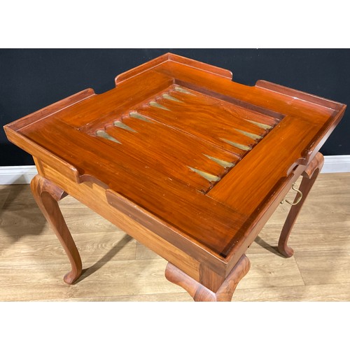 107 - A contemporary games table, removable square top inlaid for chess, the verso with baize, enclosing a... 