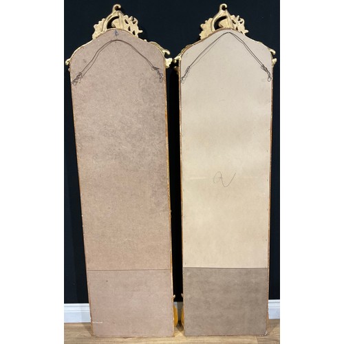 113 - A pair of contemporary Italian Baroque style gilt wall hanging mirrors, each with interlaced foliate... 