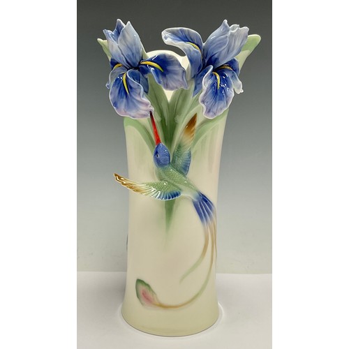 118 - A Franz porcelain vase, moulded in relief with blue orchids and drinking hummingbird, number FZ01203... 