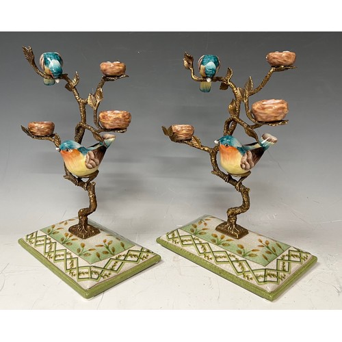 140 - A pair of gilt metal tree stands with hand painted porcelain birds perched on the  tree, faux mark, ... 