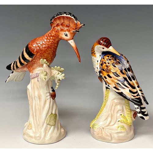 141 - A pair of contemporary 'Sevres' style porcelain models, as a Hoopoe bird and a Wadding bird, each 24... 