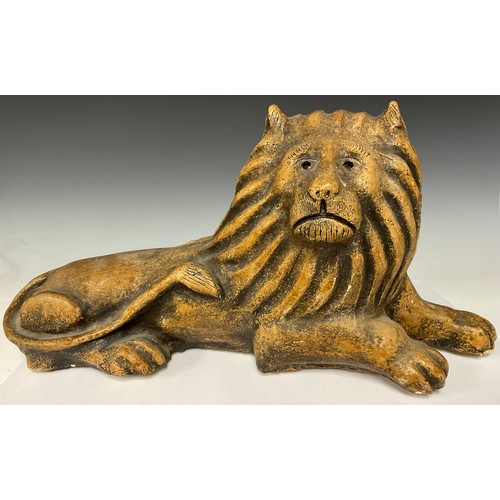 183 - A composite stone model, of a recumbent lion, in the Brampton taste, 58cm wide