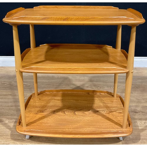 114 - An Ercol beech and elm three tier trolley, 76.5cm high, 71.5cm wide, 46cm deep