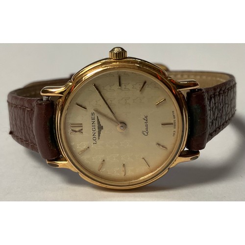 466 - A lady's Longines gold plated stainless steel watch, Champagne dial, Roman and baton indicators, ser... 