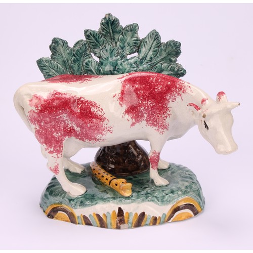 55 - An early 19th Staffordshire spongeware cow creamer, as a dairy cow, 12cm; a 19th century Staffordshi... 