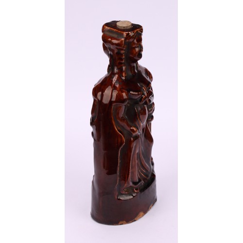 31 - A 19th century treacle glazed reform flask, moulded on both sides as Queen Victoria, 18.5cm high