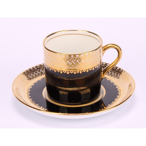 98 - An Aynsley coffee service, for six, comprising cans and saucers, each decorated in gilt on a noir gr... 