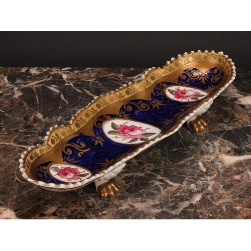 101 - An English porcelain shaped oval pen tray, the field with three oval reserves painted with pink rose... 