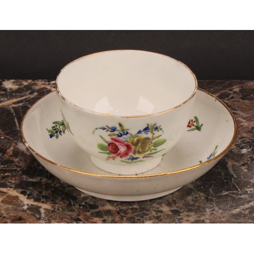 70 - A Caughley teabowl and saucer, painted in polychrome with Back to Back Roses pattern, gilt line rims... 