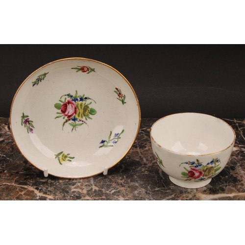 70 - A Caughley teabowl and saucer, painted in polychrome with Back to Back Roses pattern, gilt line rims... 