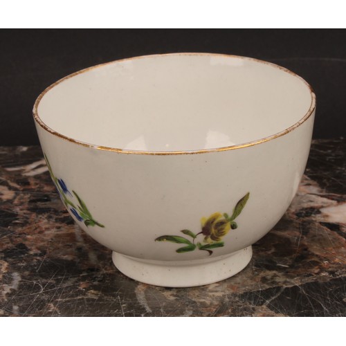 70 - A Caughley teabowl and saucer, painted in polychrome with Back to Back Roses pattern, gilt line rims... 