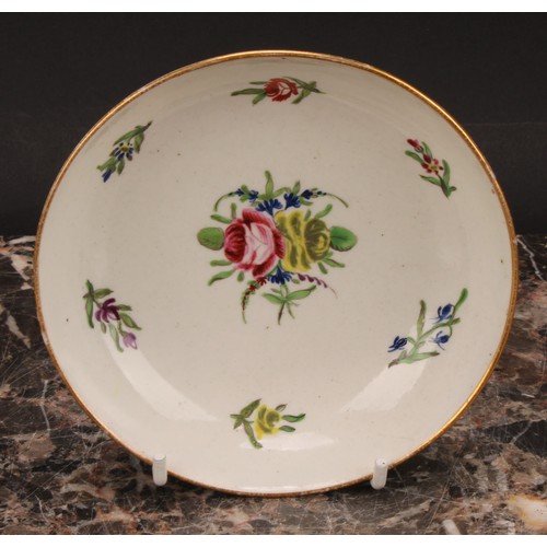 70 - A Caughley teabowl and saucer, painted in polychrome with Back to Back Roses pattern, gilt line rims... 