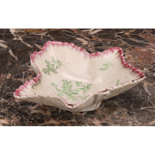 90 - A rare early Plymouth leaf shaped pickle dish, painted in polychrome with scattered green leaves ben... 