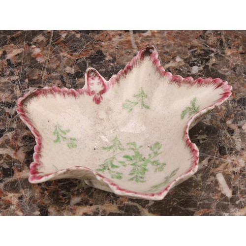 90 - A rare early Plymouth leaf shaped pickle dish, painted in polychrome with scattered green leaves ben... 