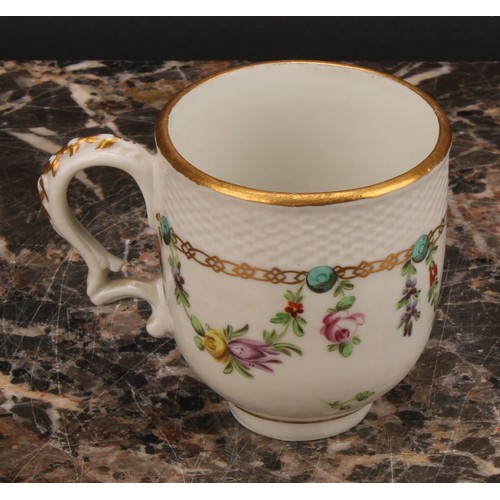 68 - A Bristol coffee cup and saucer, basket weave moulded border, enamelled with polychrome swags suspen... 