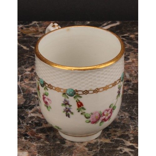 68 - A Bristol coffee cup and saucer, basket weave moulded border, enamelled with polychrome swags suspen... 