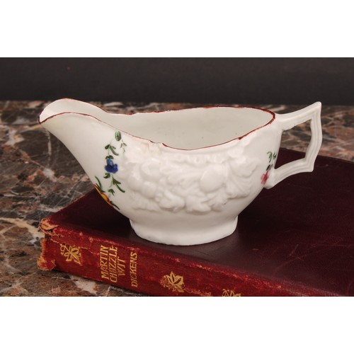 76 - A Cookworthy Bristol butter boat, moulded with fruit, painted with floral swag and sprays, 10.5cm lo... 