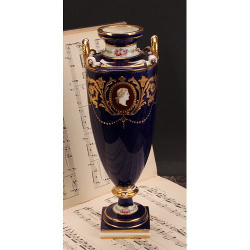 83 - A Minton two-handled pedestal vase, painted with neo-classical portraits in raised gilt oval panels,... 