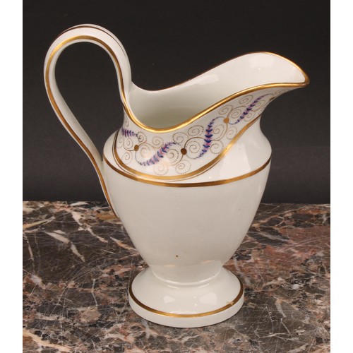 94 - A Thomas Wolfe Factory Z helmet shaped cream jug, painted with flowers within an oval gilt cartouche... 