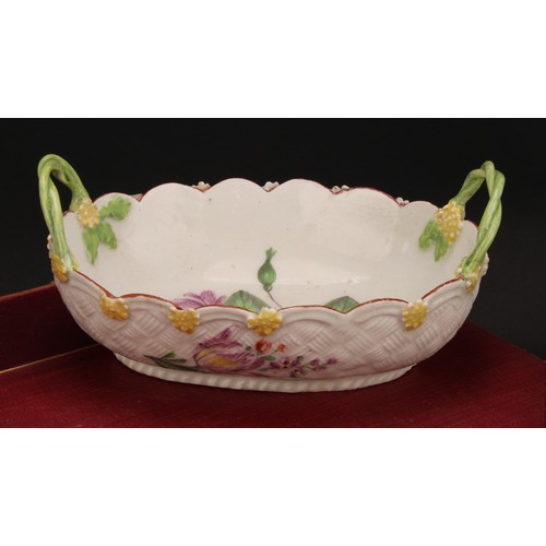 75 - A Chelsea two-handled basket, painted with flowers, the exterior with basket weave moulding and appl... 