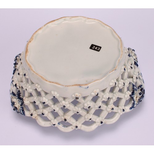 103 - An Lowestoft Pine Cone pattern two-handled oval basket, central oval reserve painted in underglaze b... 