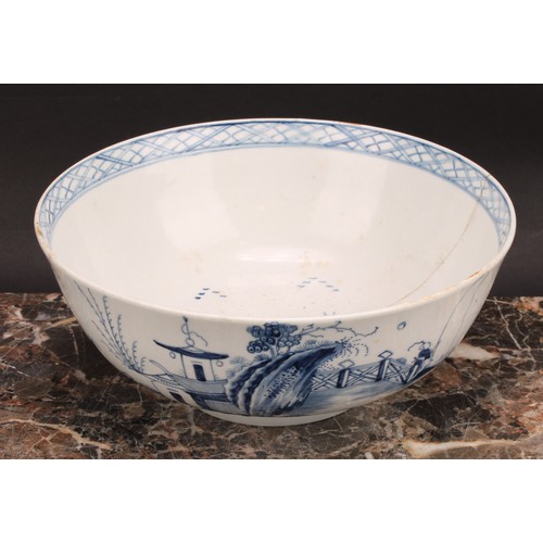 72 - A Chaffers Liverpool punch bowl, painted in Chinoiserie style in underglaze blue, with a fisherman, ... 