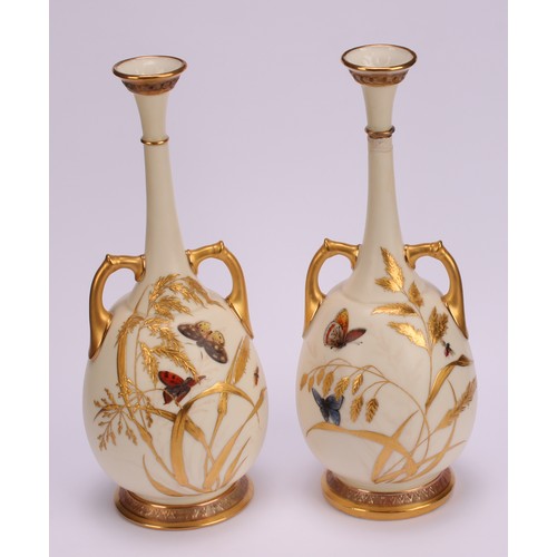 119 - A pair of Royal Worcester two handled bottle vases, decorated in the Aesthetic manner with butterfli... 