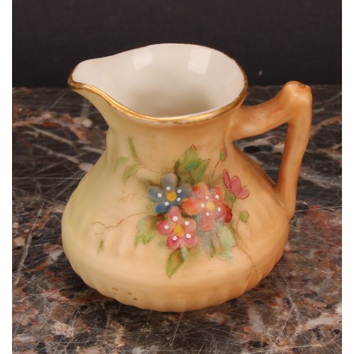 126 - A Royal Worcester blush ivory miniature two-handled vase, decorated with flowers, reticulated slight... 