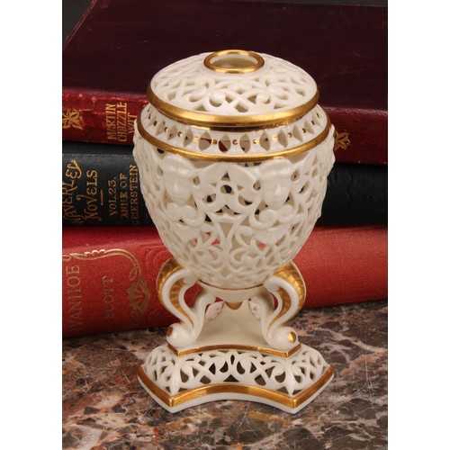 115 - A Graingers Worcester reticulated ovoid pedestal vase and cover, moulded with classical masks, three... 