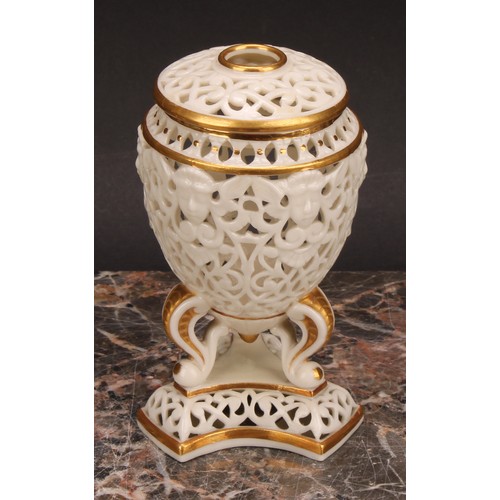 115 - A Graingers Worcester reticulated ovoid pedestal vase and cover, moulded with classical masks, three... 